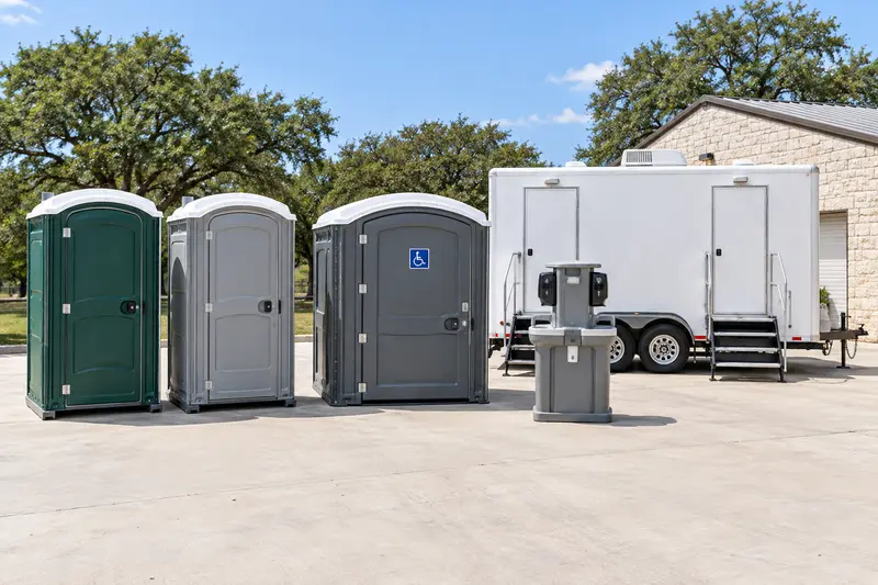 Standard and accessible portable toilets with a wash station and restroom trailer